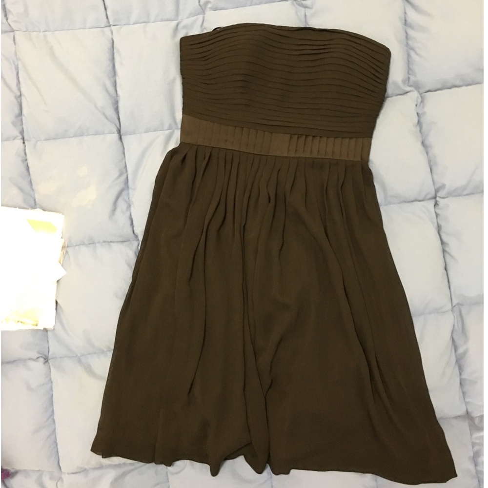Perfect little black strapless dress with pleats.